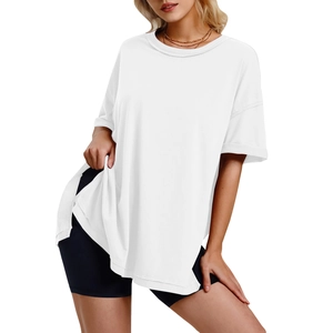 Detail view of the side slit hem and loose fit on this white crewneck cotton t-shirt