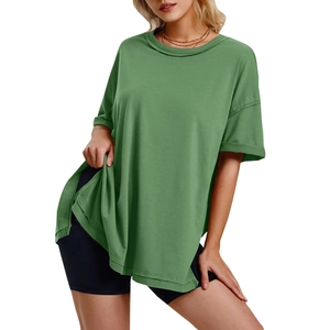 Side view of loose green cotton T-shirt with split hem and drop shoulder design