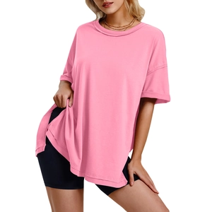 Detail view of pink loose-fit T-shirt with side slits and soft cotton fabric texture