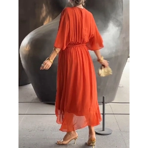 Rear view of orange tie-waist maxi dress with pleated back and batwing sleeves
