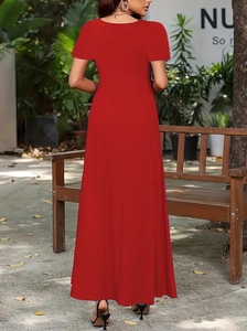 Detail of red short-sleeve high-waist maxi dress showing flowing fabric and high-cut waist