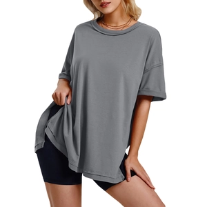 Detail of loose dark grey oversized t-shirt with side slits and soft cotton fabric