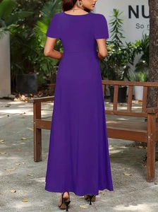 Elegant back view of long dark purple dress with high waist and flared skirt detail