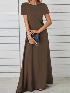 Detail of a dark brown short-sleeved crew neck maxi dress with a black clutch bag