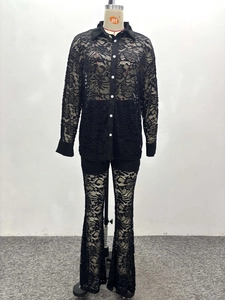 Close-up of black floral lace two-piece set featuring long-sleeved shirt and flared pants