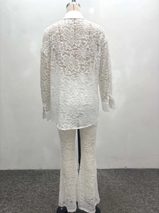 Detailed back view of a white floral lace two-piece set featuring long sleeves and trousers