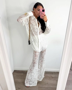 Mirror selfie showing the intricate floral lace texture of the white long-sleeve two-piece set