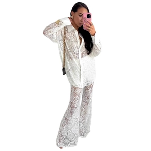 Elegant white lace two-piece set featuring long sleeve shirt and high waist trousers