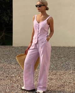 Detailed close-up of a lilac V-neck buttoned vest and matching wide-leg trousers for women