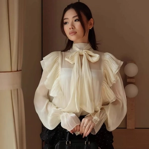 Elegant cream chiffon long sleeve blouse with ribbon bow tie neck and ruffled layered cuffs