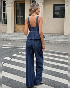 Detail of smocked back on navy striped denim peplum top and wide leg pants set