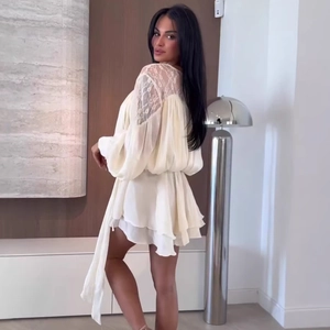 Elegant white chiffon lace tiered dress with long sleeves and back ribbon tie detail