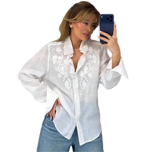 White long-sleeved lapel shirt featuring floral embroidery and button-up front style