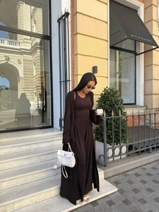 Three-piece dark brown knit set with a long cardigan, tank top, and wide-leg pants