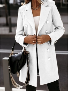 Detail of white double-breasted wool coat with large lapels and gold jewelry accents