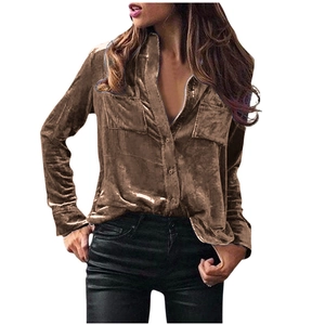 Detail of a brown velvet long sleeve shirt with metallic sheen and chest pockets