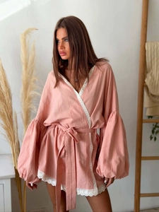 Detailed view of pink lace-trimmed cotton linen blouse with tie-up waist and lantern sleeves