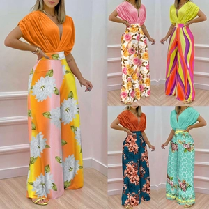 Detail of V-neck short sleeve tops with colorful floral print high waist wide leg pants