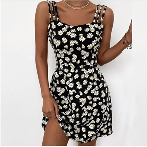 Sleeveless slim fit black mini dress with white daisy floral print and multi-strap design