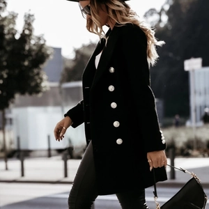 Women's black double-breasted coat with silver metal buttons in a slim fit street style