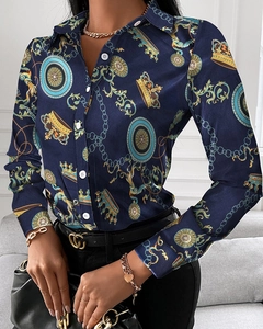 Close-up of luxury baroque print long sleeve shirt with golden crown and chain details
