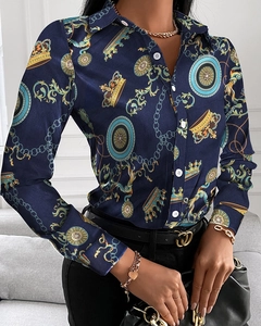 Detailed view of long-sleeve blouse featuring baroque print and glossy satin texture