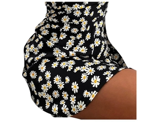 Detail view of daisy floral print on a lightweight black sleeveless summer dress fabric