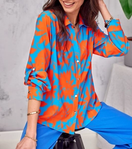 Detail of elegant blue and orange floral print shirt with stylish white buttons