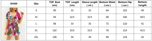 Detailed size chart for women's V-neck printed two-piece set, sizes S to 2XL in centimeters