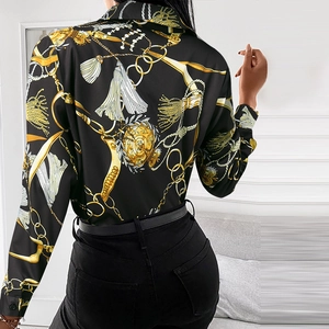 Detail view of Baroque gold chain print on high-quality black long-sleeved shirt