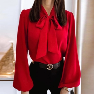Elegant red long sleeve shirt for women featuring a large bow tie neck design
