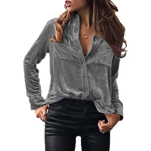 Detail of grey velvet long sleeve shirt with lapel collar and flap pockets