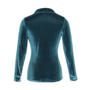 Detail view of the back of a slim-fit peacock green velvet long-sleeved shirt with collar