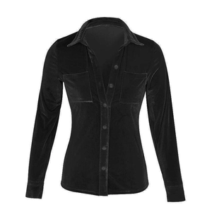 Flat lay detail of women's black velvet shirt with collar and symmetric chest pockets