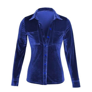 Detail of navy blue velvet shirt showing lapel collar and texture of the soft fabric