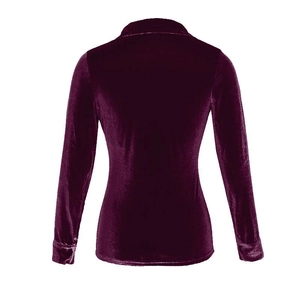Detail view of the back of a deep burgundy velvet long-sleeved shirt with collar details