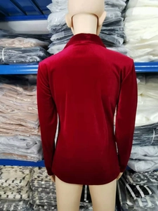 Detail of burgundy velvet long sleeve shirt showing fabric texture and slim fit design