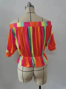 Detail showing rainbow striped off-shoulder top with elastic waist and ruffled hemline