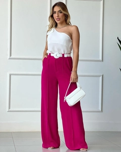 Detail of high-waisted fuchsia wide leg trousers with premium white leather belt accessory