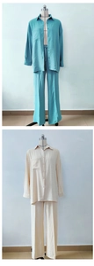 Detail of loose-fit long sleeve button-down shirt and trousers set in blue and beige