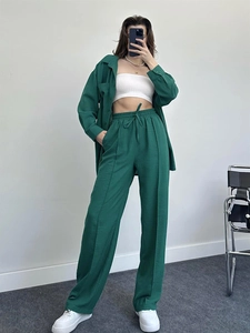 Deep green textured shirt and wide-leg drawstring pants set with pleated fabric detail