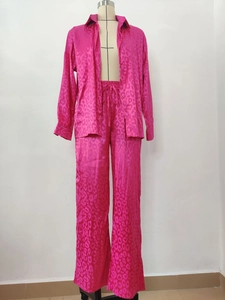 Detail of fuchsia leopard print satin shirt and wide-leg pants two-piece set