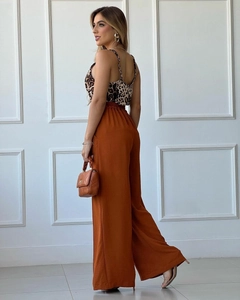 Leopard print camisole and high-waisted caramel wide-leg trousers on a model