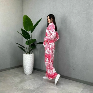 Tropical magenta print shirt and wide-leg trousers set shown in a minimalist setting