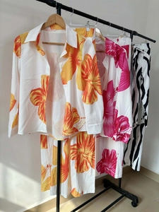 Detail of tropical floral and zebra print shirt with matching pants set for women