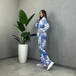 Detail of blue toile de jouy print on women's long sleeve top and wide leg pants set