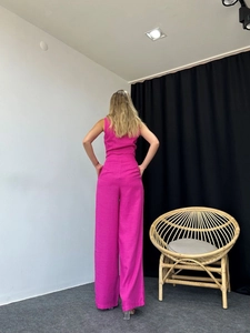Rear view of vibrant rose pink sleeveless top and high-waist wide-leg pants set