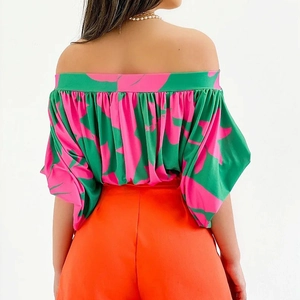 Women's floral off-shoulder top with puff sleeves and vibrant abstract botanical prints