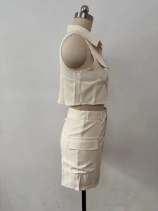 Side view of cream utility vest and cargo shorts set on a mannequin display