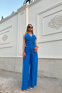 Detail of vibrant royal blue cotton-linen vest and high-waisted wide-leg trousers set